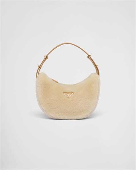 prada arqué shearling and leather shoulder bag